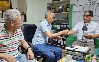 <p><strong>LOCAL COFFEE. </strong>Department of Agriculture-Philippine Rural Development Project program director Abel James Monteagudo (right) shows a sample of a local coffee product to Shigeru Chiba (center) and Masatsugu Fujimoto, the president and the executive manager, respectively, of Aj-Sewing LCC based in Tokyo, Japan. The Japanese businessmen visited the coffee farms of PRDP-assisted beneficiaries in Sta. Cruz, Davao del Sur on Monday (June 19, 2023) as part of their plan to acquire 100 tons of green coffee beans. <em>(Photo courtesy of DA-11)</em></p>