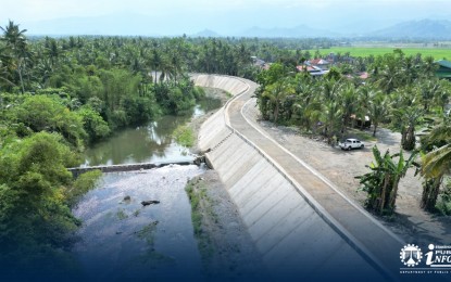 <p><strong>COMPLETED</strong>. The 232.50-meter flood control structure built by the Department of Public Works and Highways-Aurora District Engineering Office along the Pacucao River segment that runs through Barangay Cabituculan East in Maria Aurora town, Aurora province. The newly-completed project with a total cost of PHP19.6 million now serves as a crucial protection for residential areas and farmlands against river water overflow.<em> (Photo courtesy of DPWH)</em></p>