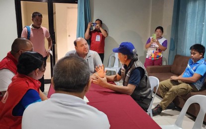 <p><strong>DISASTER RESPONSE</strong>. Negros Oriental Governor Manuel Sagarbarria (facing camera, seated) speaks to Central Visayas Regional Disaster Risk Reduction and Management Council officials on Tuesday (June 20, 2023) on disaster response and other related concerns. The officials, headed by regional director Segundo Bolo (seated, right) is seeking the establishment of a response and relief resources prepositioning hub in the province.<em> (Photo courtesy of PDRRMO-Negros Oriental)</em></p>