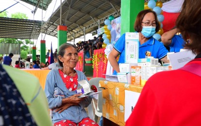 <p><strong>CARAVAN OF SERVICES.</strong> A member of the Indigenous Peoples (IPs) in Montevista, Davao de Oro is all smiles as she receives free medicines during the services’ caravan conducted by the Bureau of Jail Management and Penology on Tuesday (June 20, 2023). Among the services offered are a feeding program, free civil registration from the Philippine Statistics Authority, medical checkups, legal consultation, document drafting, and skills training. <em>(Photo courtesy of Davao de Oro PIO)</em></p>