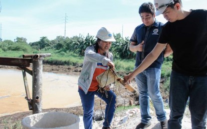 <p><strong>WATER SAMPLING</strong>. A recent collection of water samples from the wastewater treatment pond of Victorias Milling Company in Victorias City, Negros Occidental. As of Wednesday (June 21, 2023), the City Environment and Natural Resources Office reported that the mill management had “effectively controlled the adverse effects of the molasses spill on its wastewater treatment facility and resolved the issue of the foul odor”. <em>(Photo courtesy of Victorias City Information Office)</em></p>