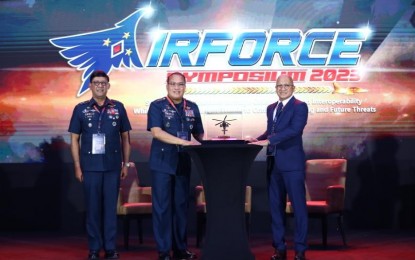 <p><strong>MEMENTO</strong>. PAF chief Lt. Gen. Stephen P. Parreño (center), assisted by PAF vice commander Maj. Gen. Ramon J. Guiang (left), present a memento to DND Assistant Secretary for Logistics, Acquisitions and Self- Reliant Defense Posture Joselito B. Ramos (right), who is representing the Secretary of the Department of National Defense as guest of honor. <em>(Photo courtesy of the PAF) </em></p>