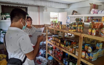 <p><strong>PRICE FREEZE</strong>. A member of the Department of Trade and Industry monitoring team checks the prices of basic commodities in Ilocos Norte province in this undated photo. The price freeze, put in place following a rabies outbreak in the province, will end on July 31, 2023. <em>(DTI Ilocos Norte)</em></p>