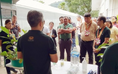 <p><strong>SAVING FORESTS.</strong> Officials and personnel of the Department of Environment and Natural Resources Region 7 and Energy Development Corporation listen to a demo on propagating native tree species. On Thursday (June 22, 2023), the officials led the re-launching of a modern Vegetative Material Reproduction nursery at the EDC's geothermal complex in Valencia, Negros Oriental. <em>(Photo by Judy Flores Partlow)</em></p>