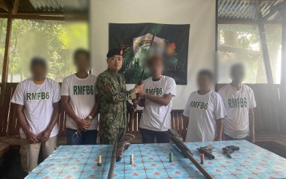 <p><strong>RETURN TO THE FOLD</strong>. Five members of the Communist Party of the Philippines - New People’s Army from the municipality of Calinog, with their assorted firearms, surrender to law enforcement authorities in the municipality of Calinog in Iloilo on Wednesday (June 21, 2023). Police Regional Office 6 spokesperson Maj. Mary Grace Borio said on Thursday (June 22, 2023) attributed the surrender to the successful implementation of the Philippine National Police retooled community support program. <em>(Photo courtesy of Regional Mobile Force Battalion 6)</em></p>