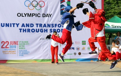 <p><strong>OLYMPIC DAY.</strong> Philippine Eskrima Kali Arnis Federation athletes performing during the 2019 Olympic Day celebration at the University of the Philippines (UP) Diliman campus in Quezon City in this file photo dated June 22, 2019. The Philippine Olympic Committee is set to celebrate Olympic Day on June 23, 2023 at the UP track oval. <em>(PNA file photo)</em></p>