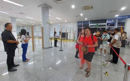 <p><strong>WARM WELCOME</strong>. City tourism chief Demetrio Alvior Jr. (1st from left) welcomes Tigerair passengers from Taipei at the Puerto Princesa International Airport on June 20, 2023. The City Tourism Office is pushing for a revival of more direct flights to the island province. <em>(File photo from the Puerto Princesa City Tourism Office)</em></p>