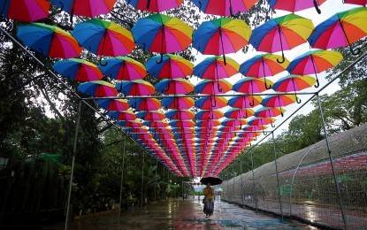 <p><strong>PRIDE MONTH.</strong> A woman walks beneath a roof of colorful umbrellas inside the Quezon Memorial Circle in Quezon City for the June 24, 2023 Pride Festival. Senate Deputy Minority Leader Risa Hontiveros on Monday (June 3, 2024) expressed high hopes that the Sexual Orientation, Gender Identity, Gender Expression, or Sex Characteristics (SOGIESC) Equality bill would be passed under the new Senate leadership. <em>(PNA photo by Joan Bondoc)</em></p>