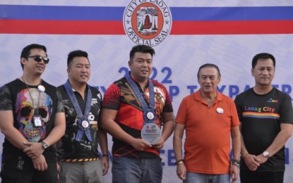 <p><strong>TOP TAXPAYERS. </strong>Some of the top taxpayers in Laoag City receive a plaque of appreciation from the city government led by Mayor Michael M. Keon on Monday (June 26, 2023). They were cited for their timely and correct payment of taxes. <em>(Contributed Photo)</em></p>