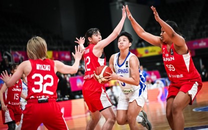 <p><strong>ANOTHER BIG LOSS</strong>. Afril Bernardino eludes towering defenders but her 12-point output was not enough to save Gilas Pilipinas from another defeat, this against Japan, 57-95, in the FIBA Women's Asia Cup at the State Sports Centre in Sydney, Australia on Tuesday (June 27, 2023). It was Gilas’ second blowout defeat after bowing to host Australia, 34-105, on Monday. <em>(Photo courtesy of FIBA Women’s Asia Cup)</em></p>