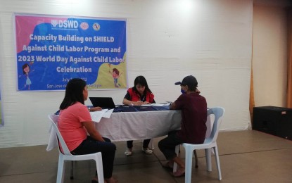 <p><strong>CHILD LABORERS.</strong> Demi Fuentespina (center), the focal person of the Strategic Helpdesks for Information, Education, Livelihood and Other Development Intervention (SHIELD) assists parents of child laborers in Antique during the release of the educational assistance in the capital town of San Jose de Buenavista, Antique province on June 7, 2023. Fuentespina said in an interview Tuesday (June 27) that more child laborers in the province will be identified once the SHIELD project is institutionalized. (<em>PNA photo by Annabel Consuelo J. Petinglay</em>)</p>