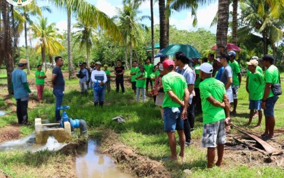 <p><strong>FARM WATER</strong>. Members of Sitio Patag Farmers Association in Macupa village in Leyte, Leyte checking the new solar-powered irrigation system project in their community. The SPIS will bring water to 10 hectares of rice farms. <em>(Photo courtesy of Department of Agriculture)</em></p>