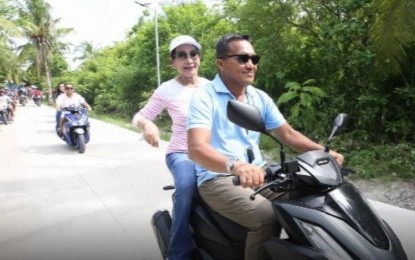 <p><strong>KINATARCAN ISLAND.</strong> Gov. Gwendolyn Garcia rides a motorcycle in visiting the Kinatarcan Island in Sta. Fe in Cebu's northwestern seaboard to inaugurate the PHP36-million circumferential road project. Sta. Fe Mayor Ithamar Espinosa said the road network project that also includes barangay road concreting is expected to boost economic activity on the island which is famous for its pristine beaches, caves and lagoon. <em>(Photo courtesy of Cebu Capitol PIO)</em></p>