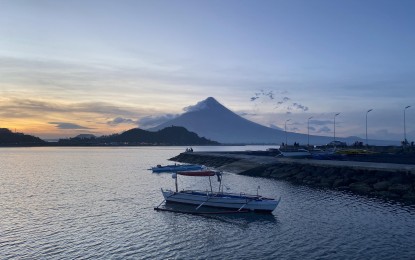<p><strong>RESTIVE.</strong> The Department of Health reminded residents living near the restive Mayon Volcano in Albay to wear masks to protect themselves from the harmful effects of ashfall. Alert Level 3 is maintained over Mayon. <em>(PNA photo by Connie Calipay)</em></p>