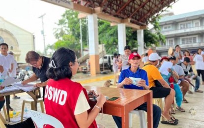 <p><strong>CASH AID.</strong> The distribution of cash grant to individuals in crisis situation in Taft, Eastern Samar in this May 3, 2023 photo. The Department of Social Welfare and Development (DSWD) in Eastern Visayas has already distributed PHP469.74 million cash as assistance to individuals in need from January to June this year. <em>(Photo courtesy of DSWD)</em></p>