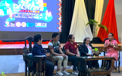 <p><strong>POTABLE WATER.</strong> Cerela Selim (right) of Barangay Rita Glenda, Basilisa, Dinagat Islands, shares the struggle of their community to access potable water and the assistance of government agencies and civic groups. The sharing is part of the Dagyaw Open Government Town Hall Meeting conducted on Thursday (June 29, 2023) in Butuan City.<em> (PNA photo by Alexander Lopez)</em></p>