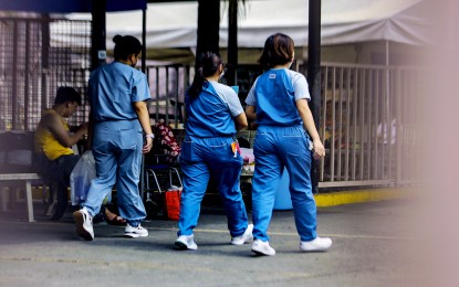 <p><strong>ESSENTIAL WORKERS.</strong> Nurses go about their tasks inside the Philippine General Hospital compound in Manila on June 27, 2023. The Department of Health on Thursday (June 20, 2024) said there are more than 2,800 job vacancies in its 76 operating units nationwide for healthcare workers. <em>(PNA photo by Joan Bondoc)</em></p>