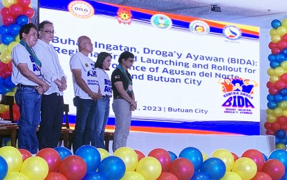 <p><strong>BIDA PROGRAM LAUNCHING. </strong>Department of the Interior and Local Government Sec. Benjamin Abalos Jr. (right), who emphasized the important roles of the community and family in the fight against illegal drugs, leads the launching of the "Buhay Ingatan, Dorga’y Iwasan” or BIDA program in Agusan del Norte which was held in Butuan City on Saturday (July 1, 2023). The DILG chief was joined by Agusan del Norte Gov. Maria Angelica Rosedell Amante (2nd from right), and Surigao del Sur Gov. Alexander Pimentel (3rd from right) during the occasion. <em>(PNA photo by Alexander Lopez)</em></p>