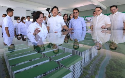 <p><strong>HOUSING PROJECT</strong>. President Ferdinand R. Marcos Jr. inspects a housing project under the Pambansang Pabahay sa Pilipino Program in the City of San Fernando, Pampanga on Monday (July 3, 2023). Also in photo are Pampanga Vice Governor Lilia Pineda (left) and Department of Human Settlements and Urban Development Secretary Rizalino Acuzar (third from right). <em>(Photo by Joey Razon)</em></p>