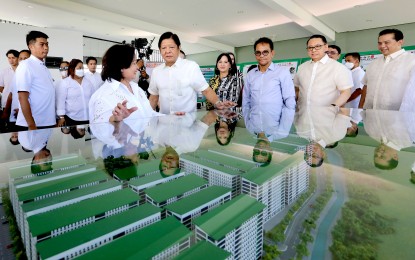 <p><strong>4PH PROGRAM</strong>. President Ferdinand R. Marcos Jr. inspects the design of mid-rise buildings in a Pambansang Pabahay Para sa Pilipino Housing (4PH) program in Pampanga on July 3, 2023. Department of Human Settlements and Urban Development Secretary Jose Rizalino Acuzar on Monday (Oct. 2, 2023) said 4PH aims to provide every family with a decent and safe home. <em>(PNA file photo)</em></p>
<p> </p>