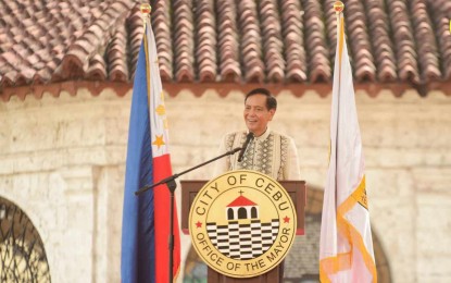 <p>‘<strong>SINGAPORE-LIKE’ DEV’T.</strong> Mayor Michael Rama delivers his State of the City Address in front of Magellan's Cross on Monday (July 3, 2023). Rama reiterated his administration's ambition to transform Cebu City into a Singapore-like metropolis. <em>(Photo courtesy of Cebu City PIO)</em></p>