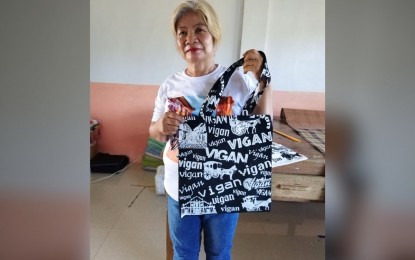 <p><strong>BAG WOMAN</strong>.  Lucila Datuin, 63, shows her newest design for her souvenir production shop in Vigan City, Ilocos Norte on June 23, 2023. Datuin started her business in 2007 using a seed money of PHP4,000. (<em>PNA photo by Hilda Aust</em>ria)</p>
<p> </p>