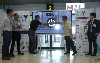 <p><strong>FREE WI-FI. </strong>Manila International Airport Authority officer in charge Bryan Co (left) says the free connectivity from Converge is aligned with their vision of a technologically-advanced transport system.  Converge on Tuesday (July 4, 2023) rolled out the free Wi-Fi at the NAIA Terminal 4. (<em>PNA photo by Yancy Lim</em>) </p>