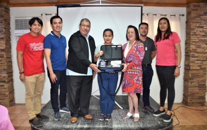 <p><strong>NEWBORN HEARING TEST</strong>. Department of Health officials hand over a newborn screening machine to one of 10 recipients in San Juan, La Union on Thursday (June 30, 2023). Each machine costs PHP412, 500. <em>(Photo courtesy of DOH Region 1)</em></p>