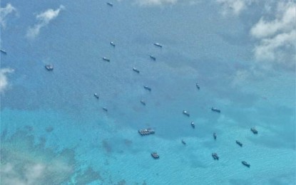 <p><strong>SWARMING.</strong> Chinese fishing vessels are seen swarming the Iroquois Reef, which is located south of the oil and gas-rich Recto Bank in the West Philippine Sea (WPS), based on the air patrol conducted by the Western Command (Wescom) on June 30, 2023. Cagayan de Oro City Rep. Rufus Rodriguez on Wednesday (July 12, 2023) said China should abide with the July 12, 2016 ruling of the Permanent Court of Arbitration by abandoning areas within the Philippines’ exclusive economic zone (EEZ) it has occupied. <em>(Photo courtesy of Wescom)</em></p>