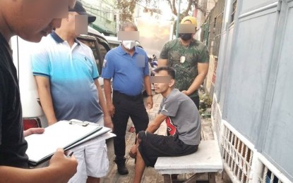 <p><strong>NABBED</strong>. An unnamed claimant of over PHP3 million worth of shabu shipment faces authorities during a controlled delivery operation in Makati City on Wednesday (July 5, 2023). He was arrested by the joint operations of the Bureau of Customs-Port of Clark and the Philippine Drug Enforcement Agency. <em>(Photo courtesy of Bureau of Customs)</em></p>