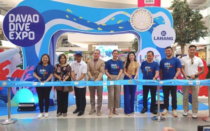 <p><strong>DIVE EXPO.</strong> Officials of the Department of Tourism in Davao Region and diving industry stakeholders lead the ribbon cutting on Friday (July 7, 2023) during the opening of the Davao Dive Expo 2023 at SM Lanang Premier in Davao City. The three-day event will showcase the region's aqua-sports activities such as island hopping, snorkeling, skimboarding, free diving and scuba diving.<em> (PNA photo by Robinson Niñal Jr.)</em></p>