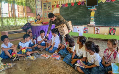 <p><strong>BOOK DRIVE.</strong> Beneficiaries of books and school supplies donation drive in Roxas village in Northern Samar. The Philippine Army has expanded the initiative in a bid to help suppress the insurgency. <em>(Photo courtesy of Philippine Army)</em></p>