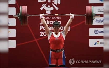 <p><strong>WAIT AND SEE.</strong> A North Korean weightlifter participates in the 2018 Indonesia Asian Games. The reclusive country sent a preliminary list of athletes for the Riyadh World Weightlifting Championships in September but its participation has not been confirmed. <em>(Yonhap)</em></p>