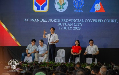 <p><strong>SUPPORTING FARMERS.</strong> President Ferdinand R. Marcos Jr. leads the turnover of PHP34.8 million worth of livelihood support, machinery, and equipment to farmers and associations in Agusan del Norte during the distribution ceremony at the provincial capitol in Butuan City on Wednesday (July 12, 2023). The President is joined during the occasion by (seated left to right) Agusan del Norte (1st District) Rep. Jose Aquino, Special Assistant to the President Secretary Antonio Lagdameo, Agusan del Norte Gov. Maria Angelica Rosedell Amante and Butuan City Mayor Ronnie Vicente Lagnada.<em> (Photo courtesy of DA-13)</em></p>
