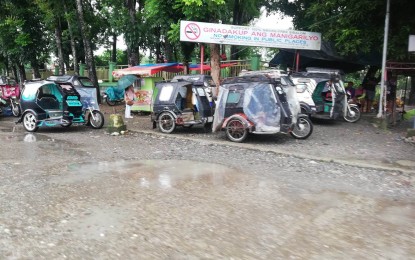 <p><strong>BE ALERT</strong>. Tricycles wait for passengers amid the heavy rainfall in Sibalom town, Antique province on July 13, 2023. Michael Tolentino, Local Disaster Risk Reduction and Management Officer III, said in an interview Thursday (July 13) that residents in the province are advised to be vigilant against flooding and landslides. (<em>PNA photo by Annabel Consuelo J. Petinglay</em>)</p>