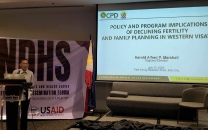<p><strong>LOW FERTILITY RATE</strong>. Commission on Population and Development (CPD) Regional Director Harold Alfred Marshall speaks during the regional dissemination forum for the 2022 National Demographic and Health Survey (NDHS) held in Iloilo City on Thursday (July 13, 2023). He said the declining total fertility rate (TFR) in the region provides the opportunity to accelerate development, reduce poverty and improve labor force participation. <em>(PNA photo by PGLena)</em></p>