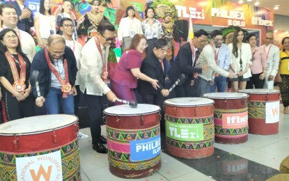<p><strong>TRI-EXPO</strong>. Guests during the opening of the first tri-expo on travel and leisure, infrastructure and food and beverages bang the drums to open the four-day event at the Iloilo Convention Center on Thursday (July 13, 2023). The event, which runs until July 16, gathers over 400 participating firms and is expected to usher more than 15,000 participants. <em>(PNA photo by PGLena)</em></p>