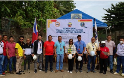 <p><strong>STREETLIGHT PROJECT.</strong> Mayor Jose Paolo Evangelista (5th right), DILG-12 director Josephine Leysa and other local officials pose for a photo following the official installation of the first pole for the PHP7-million street lighting project in Kidapawan City on Thursday (July 13, 2023). The project is funded from the Seal of Good Local Governance incentive won by the local government in 2022. <em>(Photo courtesy by Kidapawan CIO)</em></p>