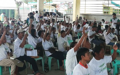 <p><strong>HEALTH SERVICES.</strong> Residents of Luna Apayao show their Philippine Health Insurance Corp. cards during the regional rollout of the "Konsulta Package" on Thursday (July 14, 2023). The PhilHealth cards allow holders and their beneficiaries to avail of basic health services from rural health units without the need to go to the hospital. <em>(PNA photo by Liza T. Agoot)</em></p>