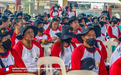 <p><strong>PAYOUT.</strong> At least 748 Mayon-affected residents from Guinobatan town in Albay province received payments on Thursday (July 13, 2023) after rendering community service in evacuation centers. The payout for the Mayon-affected beneficiaries staying in Mauraro Elementary School is part of the assistance provided by DOLE during President Ferdinand R. Marcos Jr.'s visit to Albay last month. <em>(Photo courtesy of DOLE- Bicol)</em></p>