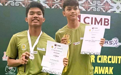 <p><strong>1-2 FINISH.</strong> The Philippines won the gold and silver medals in the boys' U-17 category of the CIMB National Junior Circuit Leg 2 in Sarawak, Malaysia on July 9, 2023. Jonathan Reyes (right) defeated Christopher Buraga, 7-11, 11-4, 5-11, 16-14, 11-9, in the final.<em> (Contributed photo)</em></p>
