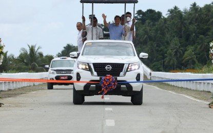 <p><strong>ROAD TO PROGRESS.</strong> President Ferdinand R. Marcos, Jr. passing a portion of the Samar Pacific Coastal Road project in Palapag, Northern Samar, on Friday (July 14, 2023). The 11.6-kilometer road project was completed last month after five years of construction. <em>(PNA photo by Rey Baniquet)</em></p>