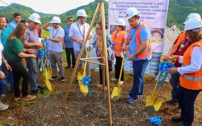 <p><strong>HOUSES FOR QUAKE VICTIMS.</strong> National Housing Authority General Manager Joeben Tai (in blue shirt) and North Cotabato lead the groundbreaking ceremony of a PHP368-million housing project in Barangay Sto. Niño, Makilala, North Cotabato Thursday (July 13, 2023). The project entails the construction of 1,329 housing units for families displaced by the 2019 earthquake.<em> (Photo courtesy of North Cotabato-PIO)</em></p>