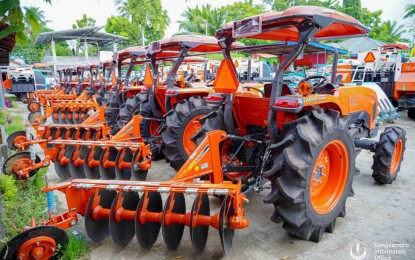 <p><strong>FARMERS’ PARTNERS.</strong> The Bangsamoro Autonomous Region in Muslim Mindanao, through the Ministry of the Interior and Local Government, turns over farm tractors and other equipment to farmers and fisherfolk in 13 villages in Midsayap, North Cotabato, on Thursday (July 13, 2023). Some 600 farmer-beneficiaries in the Special Geographic Area-Midsayap cluster benefited from the assistance.<em> (Photo courtesy of Bangsamoro Information Office-BARMM)</em></p>