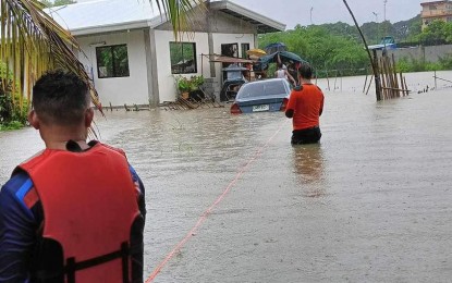 <p>FLOODING. Personnel from the Municipal Disaster Risk Reduction and Management Office in Masinloc, Zambales conduct pre-emptive evacuation of residents affected by flooding on Friday (July 14, 2023). Moderate to heavy rains are being experienced in the province due to Tropical Depression Dodong<em>. (Photo courtesy of the Masinloc MDRRMO)</em></p>