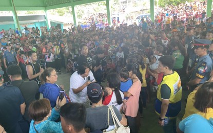 <p><strong>BRINGING HAPPINESS.</strong> Celebrity guest Willie Revillame (in white, with mic) interacts with evacuees in Tabaco City, Albay province on Saturday (July 15, 2023). Revillame entertained families who were forced out of their homes in Daraga, Camalig, Sto. Domingo, and Tabaco City due to Mayon Volcano's unrest. <em>(PNA photo by Connie Calipay)</em></p>