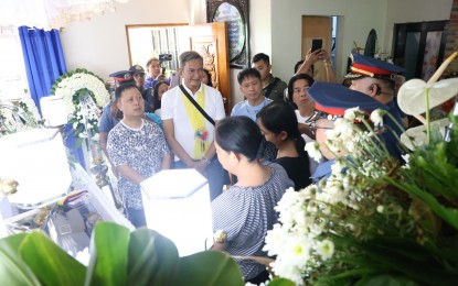 <p><strong>CONDOLENCES</strong>. Ako Bicol Party-list Rep. Elizaldy Co and Albay 2nd District Rep. Joey Salceda (1st and 2nd from left) visit the wake of slain Chief Master Sergeant Joseph Ostonal in Ligao City, Albay province on Saturday night (July 15, 2023). Ostonal and fellow police officer Corporal Jeffrey Refereza were killed while on duty in Oas town on July 9. <em>(Photo courtesy of Rep. Elizaldy Co's office)</em></p>