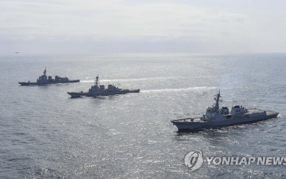 <p>DEFENSE DRILL. This file photo, provided by Seoul's Navy on April 17, 2023, shows South Korean, U.S. and Japanese warships taking part in a missile defense exercise in the international waters of the East Sea. <em>(Yonhap)</em></p>
