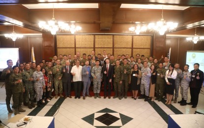<p>Participants and facilitators of the three-day Security Sector Assistance Roadmap Working Group Workshop during the closing ceremony on July 13, 2023. <em>(Photo courtesy of AFP) </em></p>
