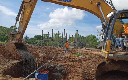 <p><strong>SHELTER PROJECT</strong>. Workers lay the foundation at the site of the Yuhum Residences housing project in Barangay Vista Alegre, Bacolod City in June. The project is being implemented under the Pambansang Pabahay Para sa Pilipino Housing (4PH), the flagship shelter program of the Marcos administration.<em> (Photo courtesy of Albee Benitez Facebook page)</em></p>